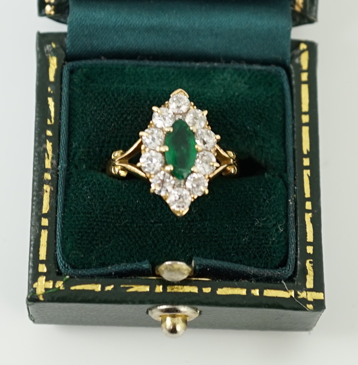 A Victorian style gold, emerald and diamond set marquise cluster shaped ring